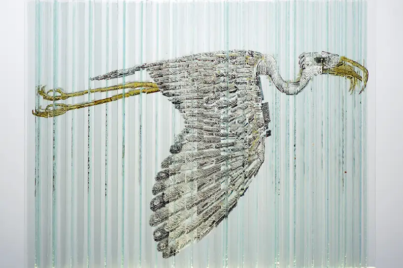 Side with bird of glass cube with four anamorphic paintings