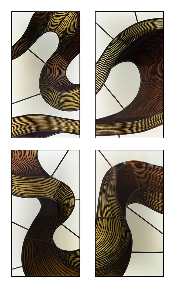 Stained glass window with a painted depiction of a serpentine ribbon in shades of brown and beige