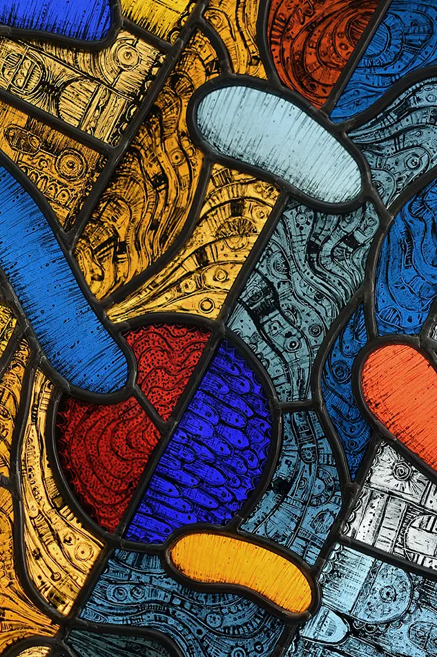 Detail of a free-hanging and illuminated stained glass window with detailed painting which is named Amoeba and hangs in a forest