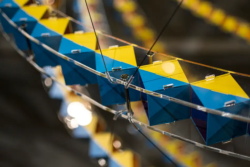Detail of spherical art installation LudoModuL which plays with colour changes using different coloured wooden cubes