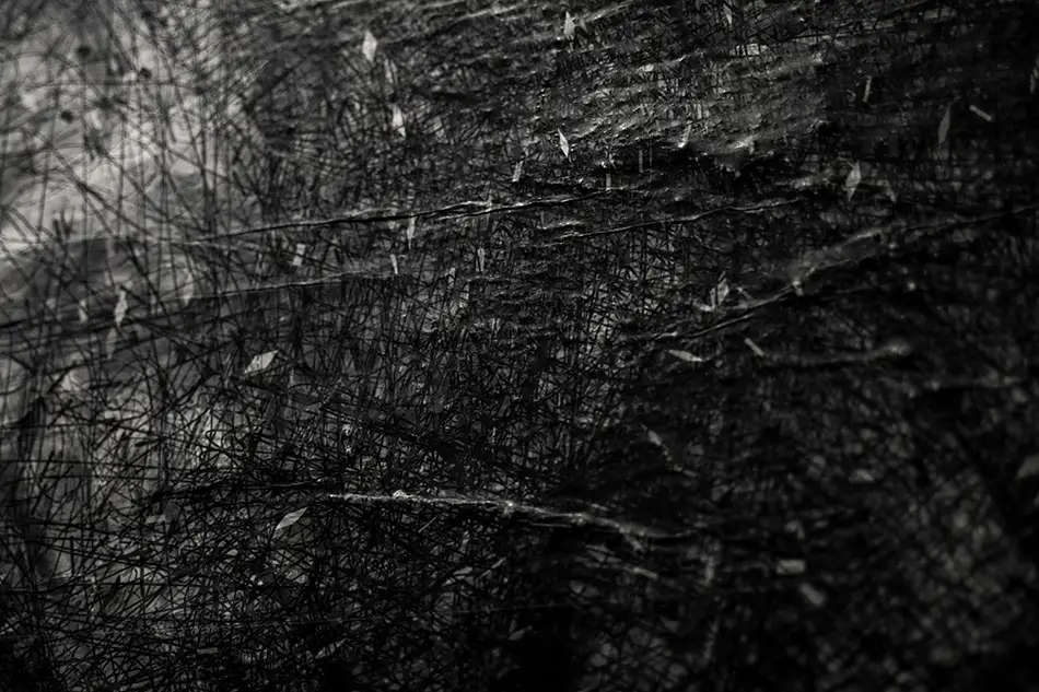 Close up of street art paste-up of digitally printed vector drawing of an exposion-like black snowflake
