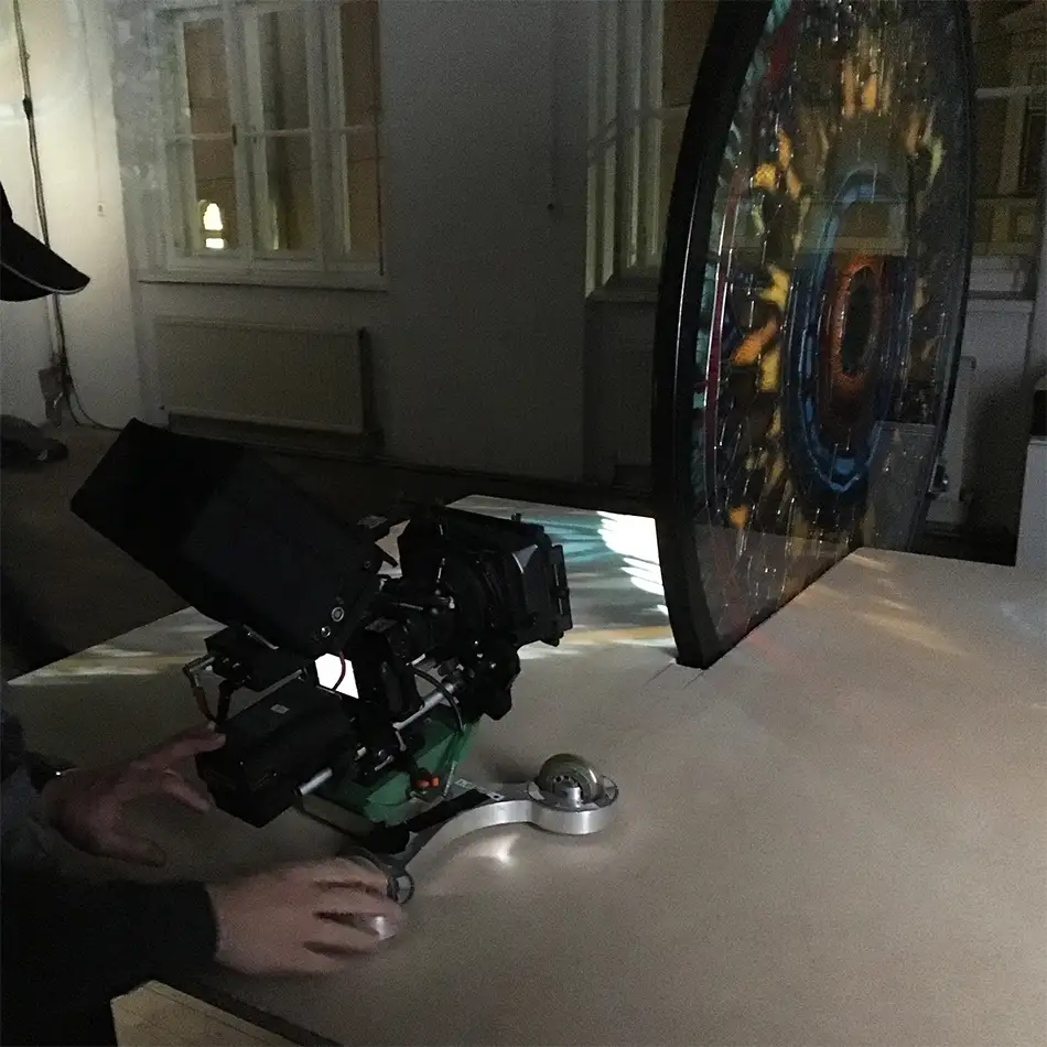 Film shoot of a detailed painted lead glazing reminiscent of a gigantic fluorescent cell
