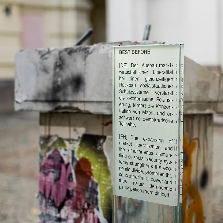 glass panel with accompanying text for filapidated concrete lectern as art in public space