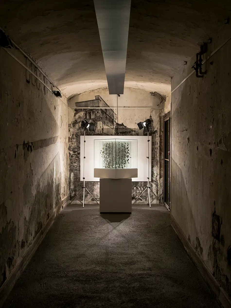 Anamorphic artwork - glass cube with four different images composed of image fragments - exhibition view Bäckerei Kulturbackstube