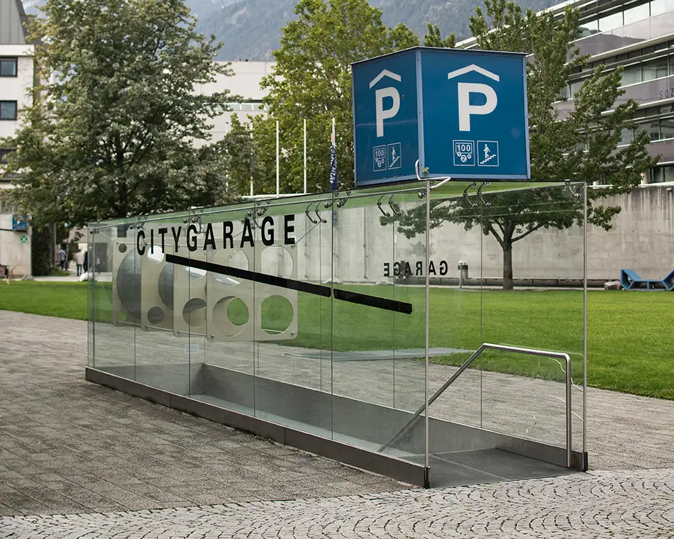 Anamorphic installation in public space in which an eye is visible in a cone - Staircase Sowi Innsbruck