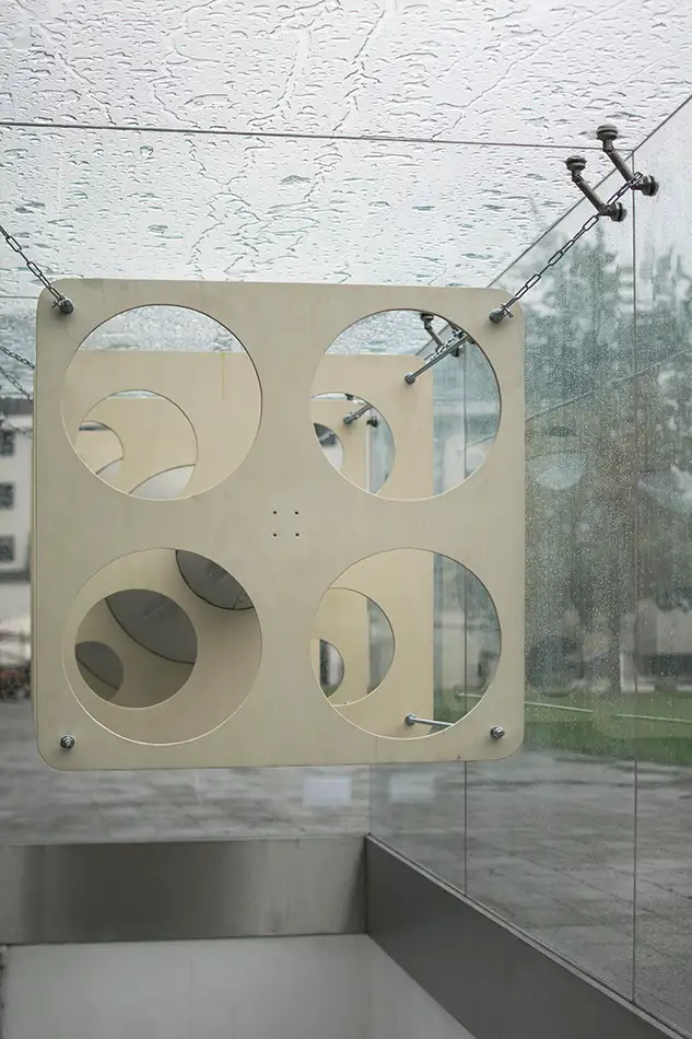 Anamorphic installation in public space in which an eye is visible in a cone - Detail in the rain