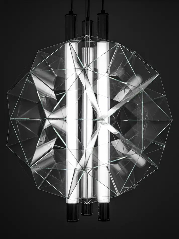 spherical glass sculpture that is geometrically based on the geodesic dome - used as a lampshade with lights on